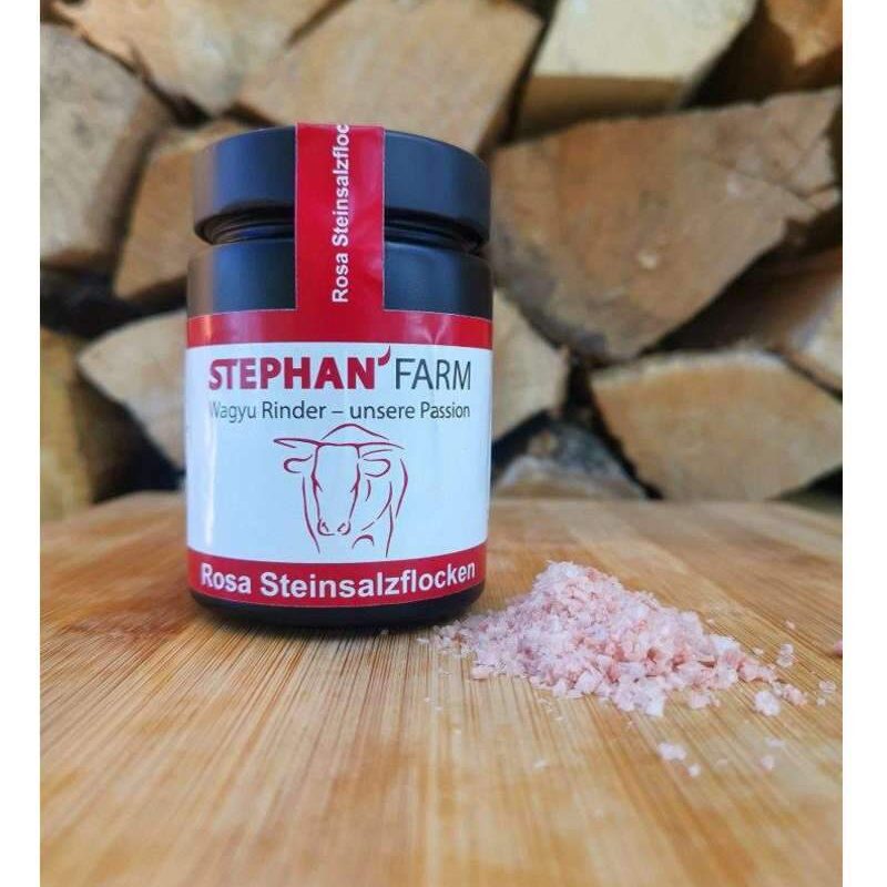 Rosa Steinsalzflocken in Glasbehälter